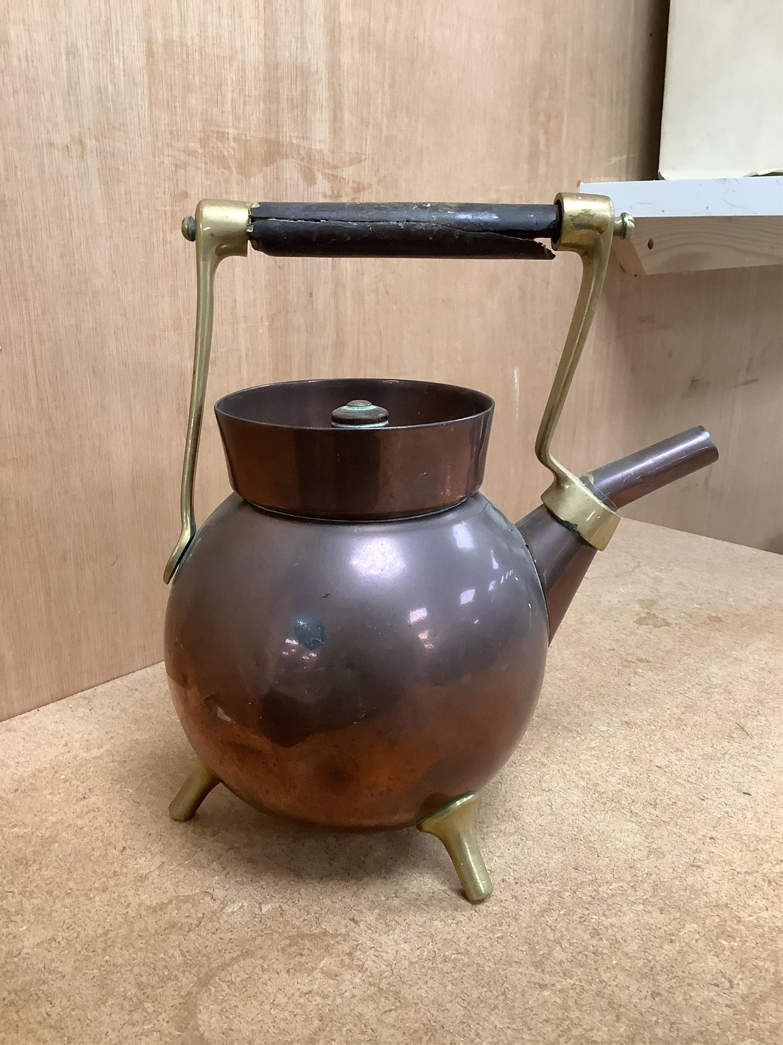 An Arts and crafts copper and brass Benham & Froud stamped Christopher Dresser teapot, (A.F), together with a two handle tray stamped Torini &Sons, Tray 49cm wide.